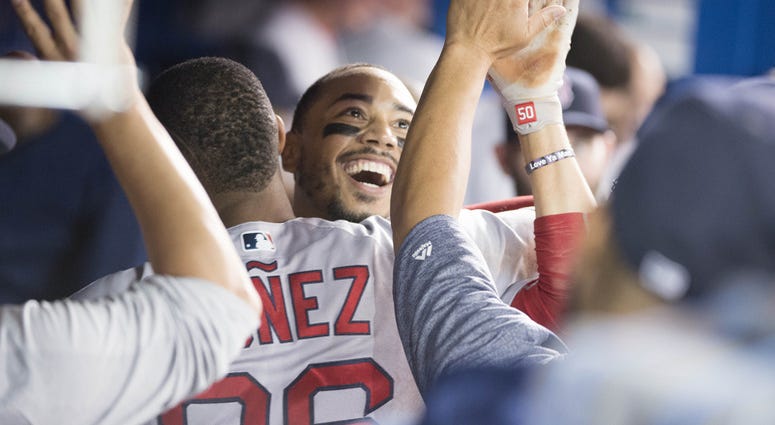 Mookie Betts is congratulated after his HR gave him the cycle in Toronto. Mookie Betts